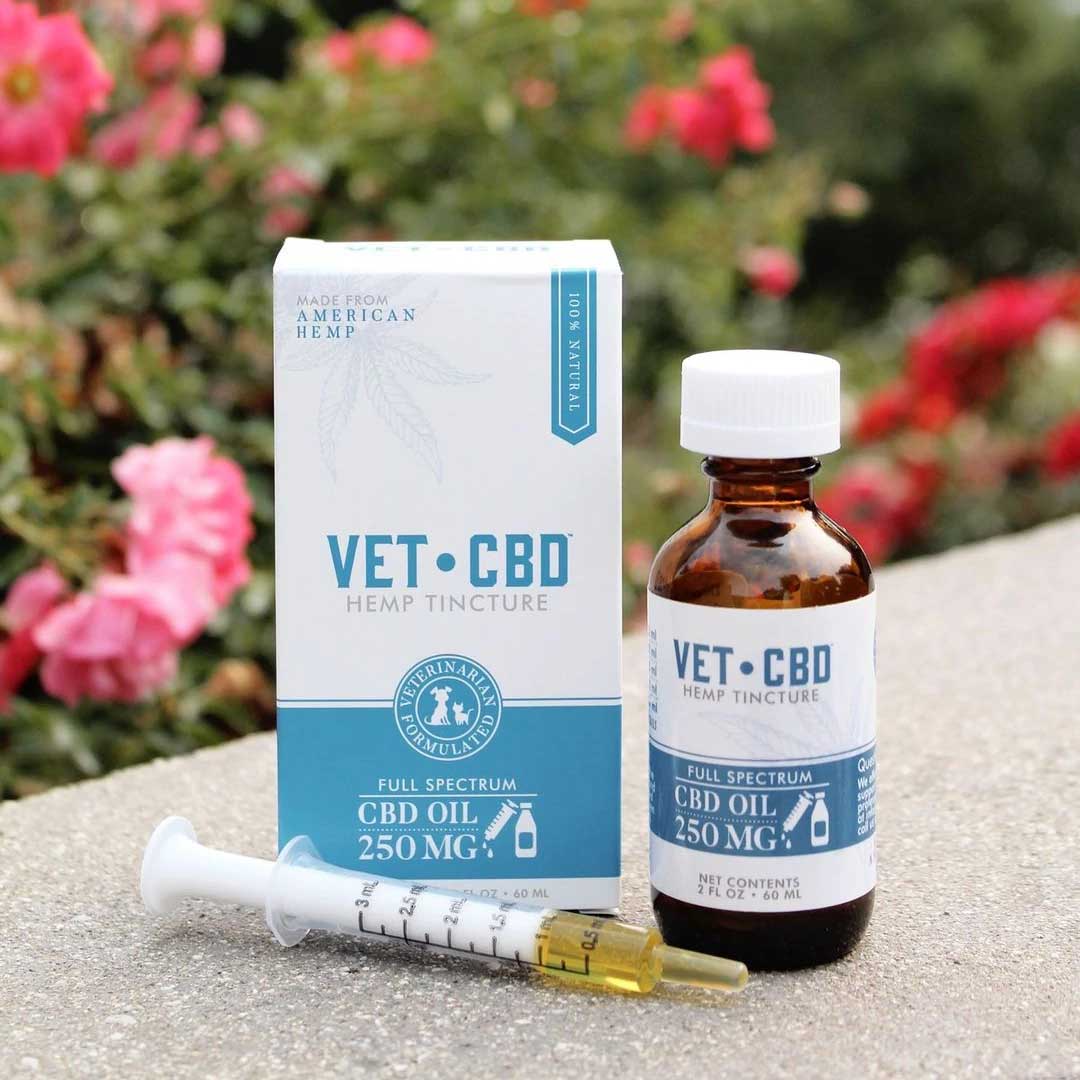 VETCBD Hemp Oil with packaging in natural light ā The product and packaging positioned in a well-lit setting, emphasizing the natural ingredients and organic appeal